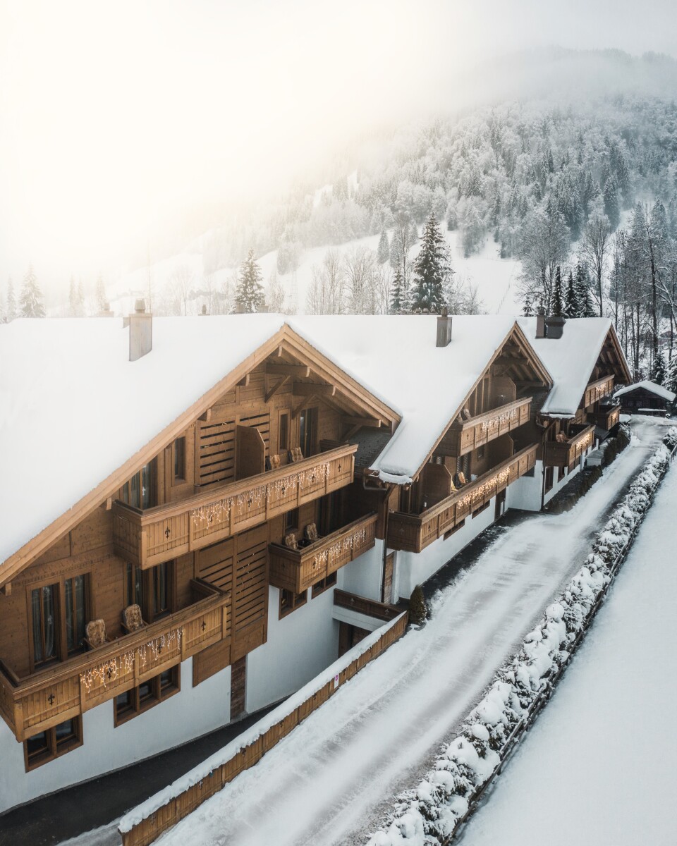 ultima-collection-ultima-gstaad-three-wooden-chalets-winter-1